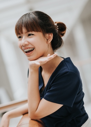 Woman with adult orthodontics smiling
