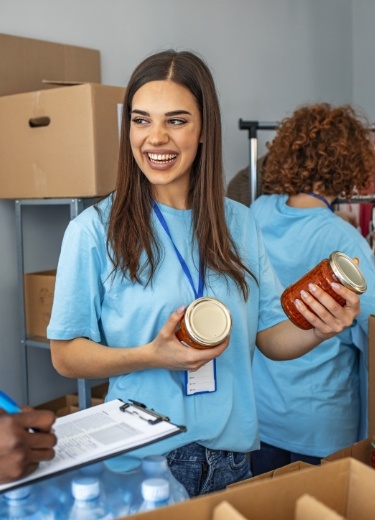 People volunteering at a food drive