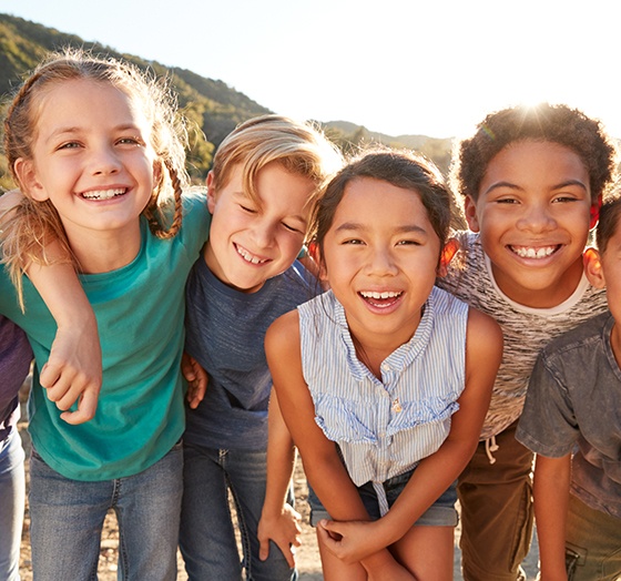 Group of happy kids enjoying time outdoors