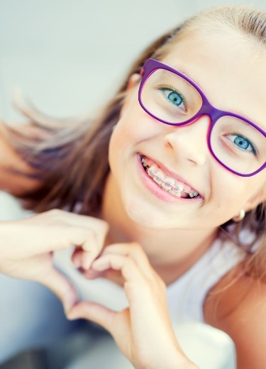 Child smiling after receiving dentofacial orthopedics