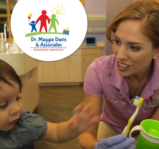 Pediatric dentist Doctor Maggie Davis treating child in dental office