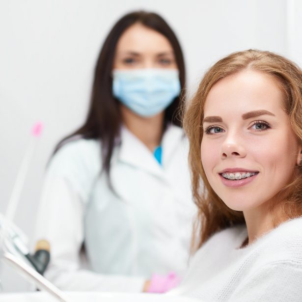 Woman smiling during dentofacial orthopedics visit