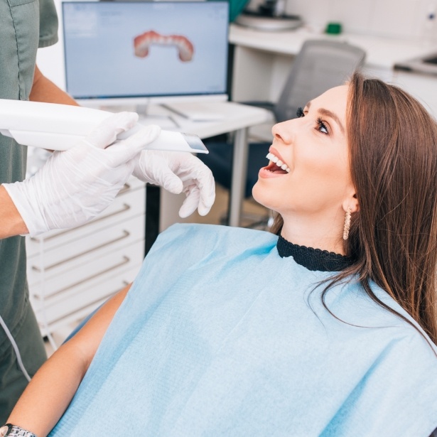 Woman smiling during Nyce smile aligner consultation