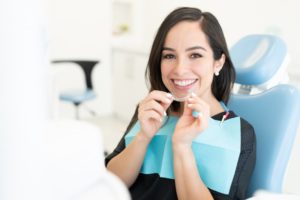 Woman removing clear aligners