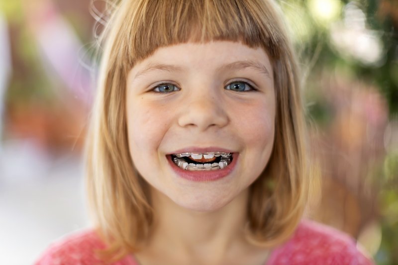 smiling child with braces