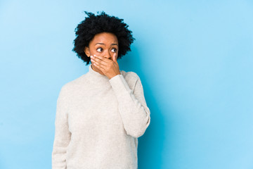 person experiencing teeth shifting covering their mouth