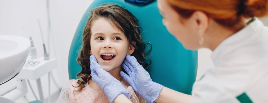 A little girl getting an orthodontic exam