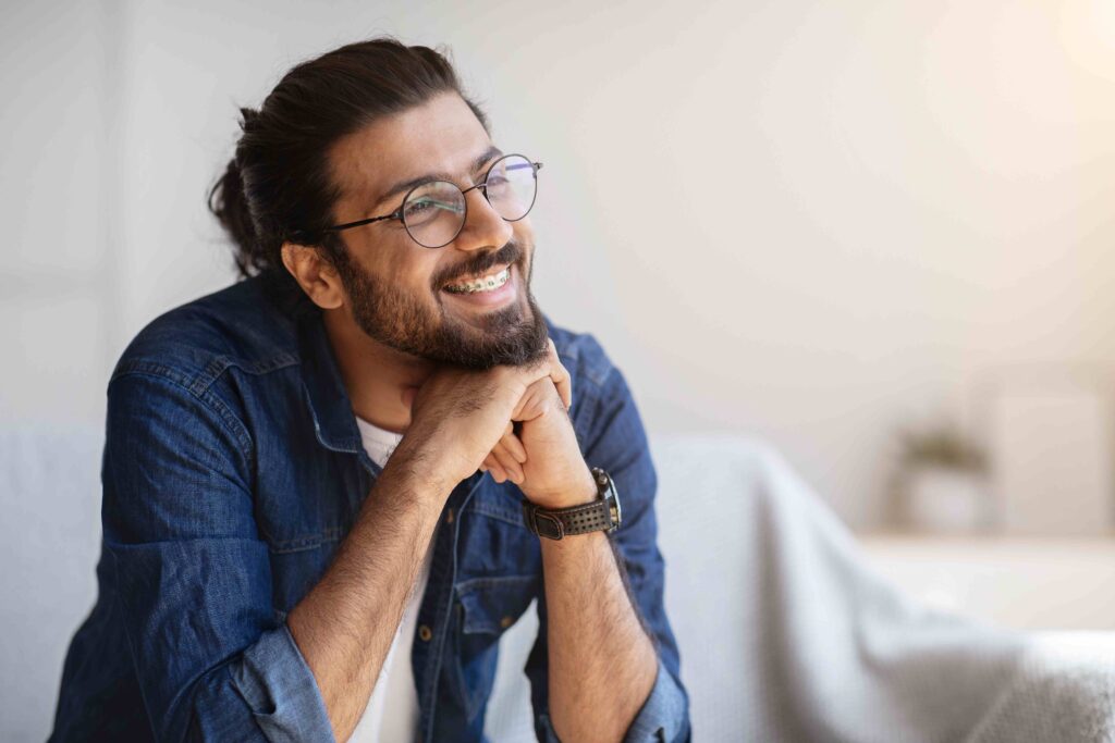 Man smiling with braces